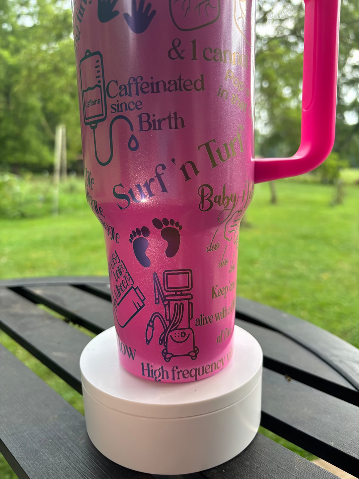 Pink tumbler with text and graphics